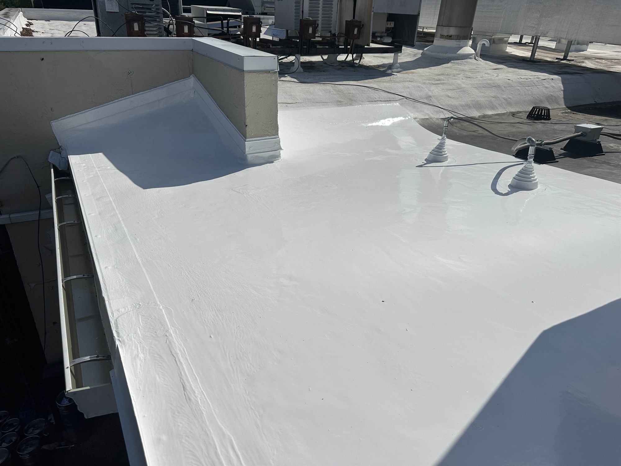 Bright white silicone coating finished on a commercial flat roof