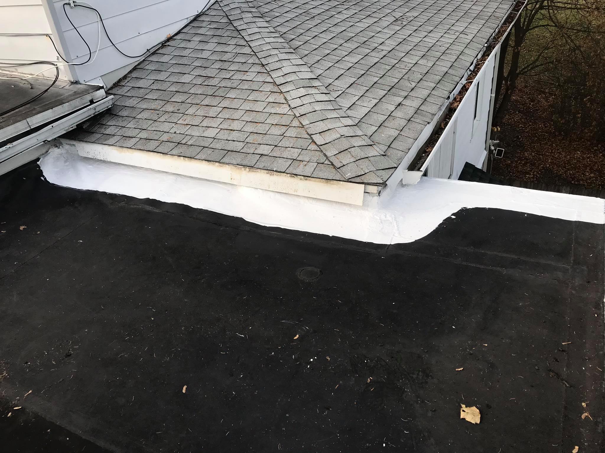 Repairing flashing detail at roof transition with silicone coating