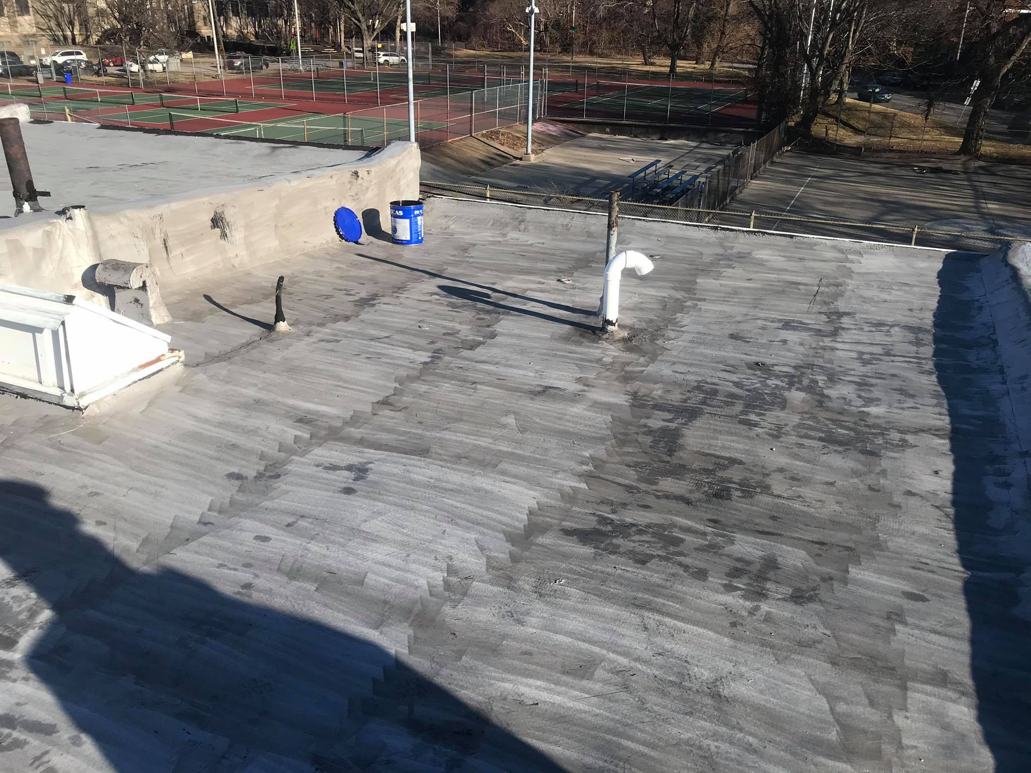 Weathered modified bitumen roof before restoration coating