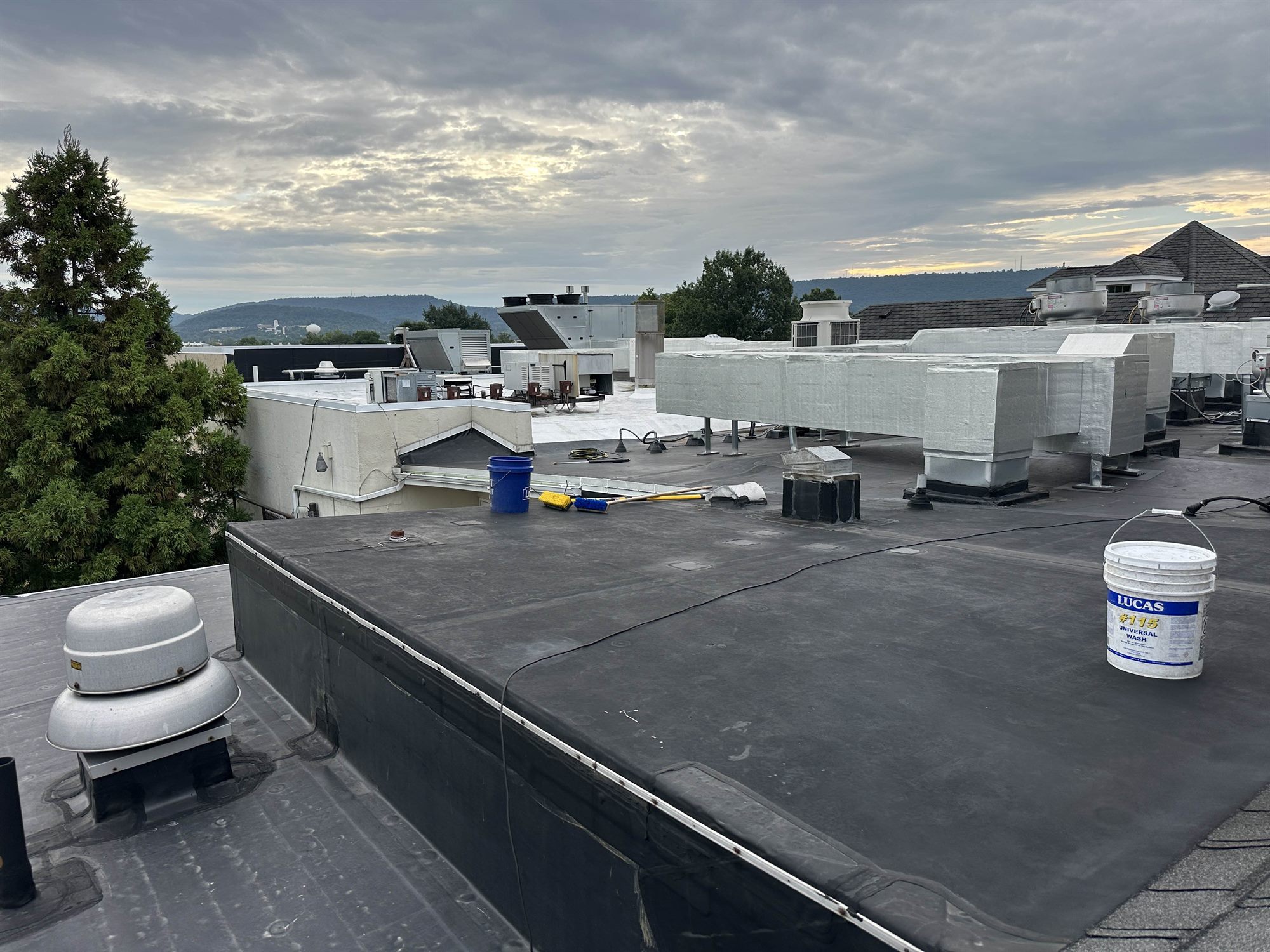 Reading PA commercial EPDM roof before silicone coating, dark and worn