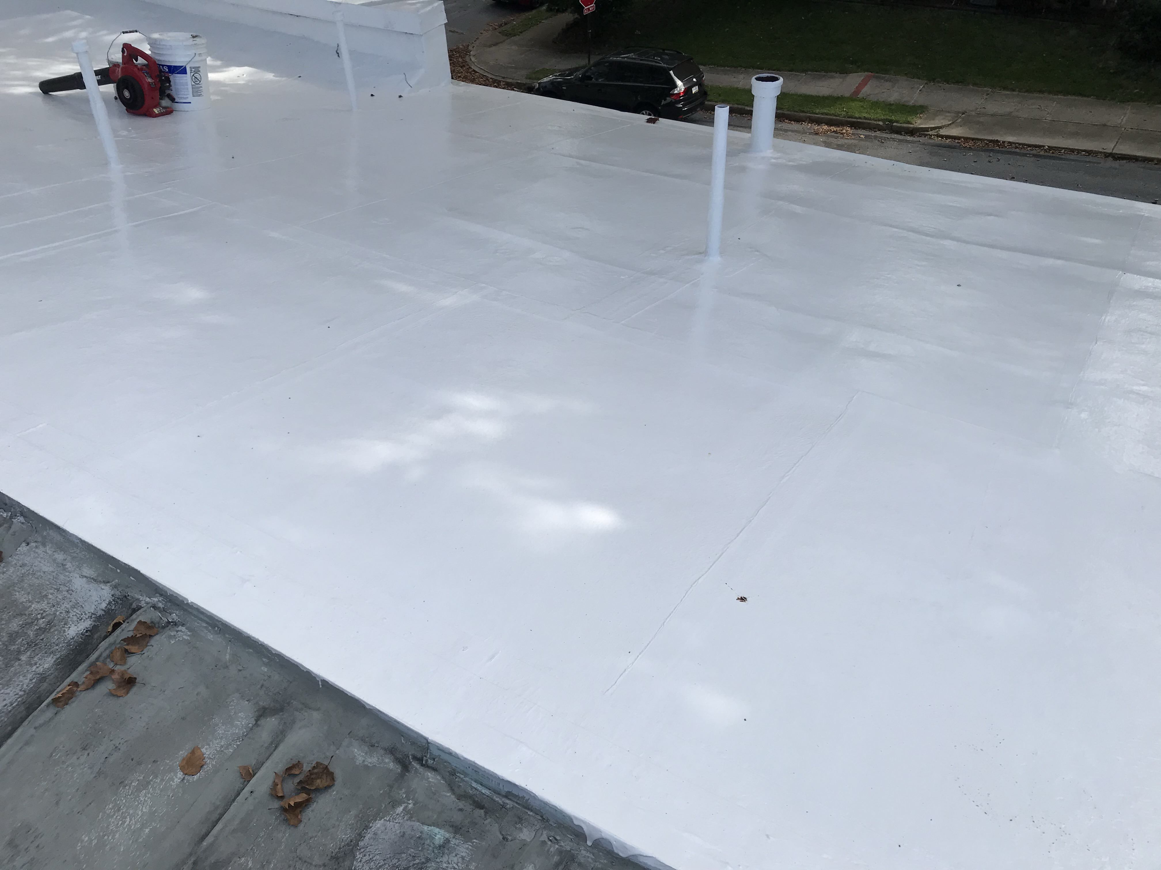 Completed silicone roof coating, bright white finish